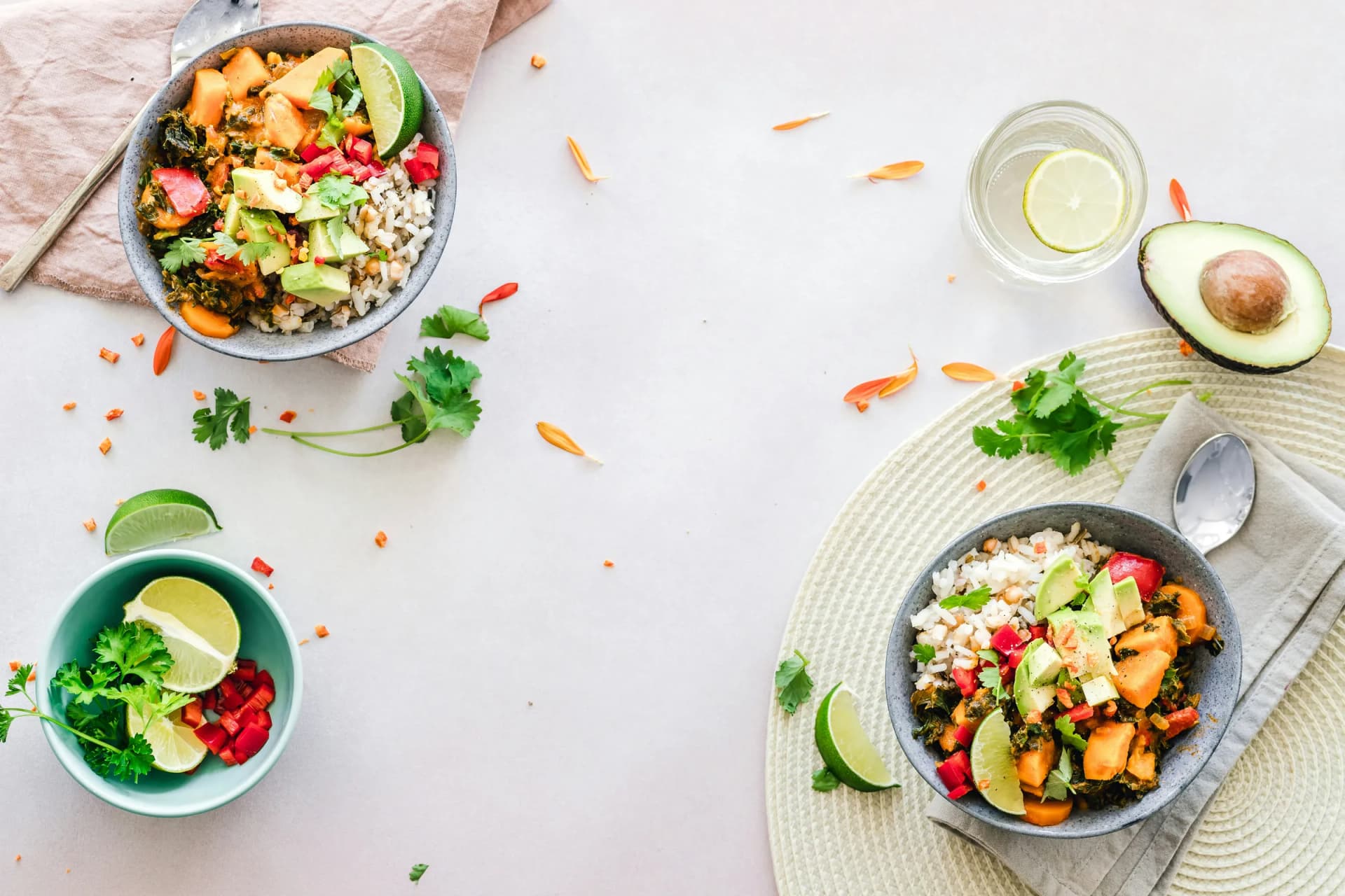 Bright bowls of food on a pale table